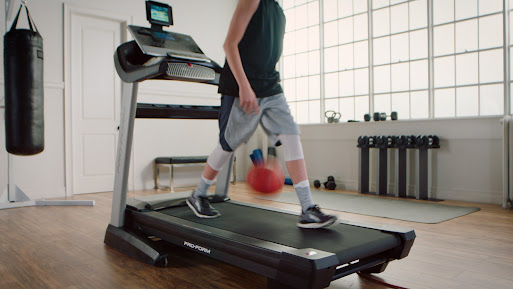 Utah basketballer Luke Facer shows off ball handling skills on a ProForm treadmill
